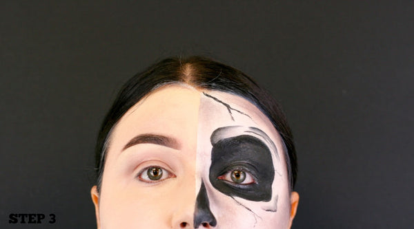 step 3 outline nose and fill in with black face paint and draw cracks on face