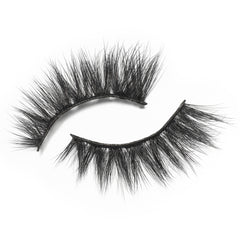 A pair of the Eylure 3/4 Length Lashes - 024, with their bold and voluminous black design, is set against a white background. These Eylure lashes are vegan-friendly, thick, and fluffy with a slightly curved shape to enhance eye makeup for a striking cat-eye effect.