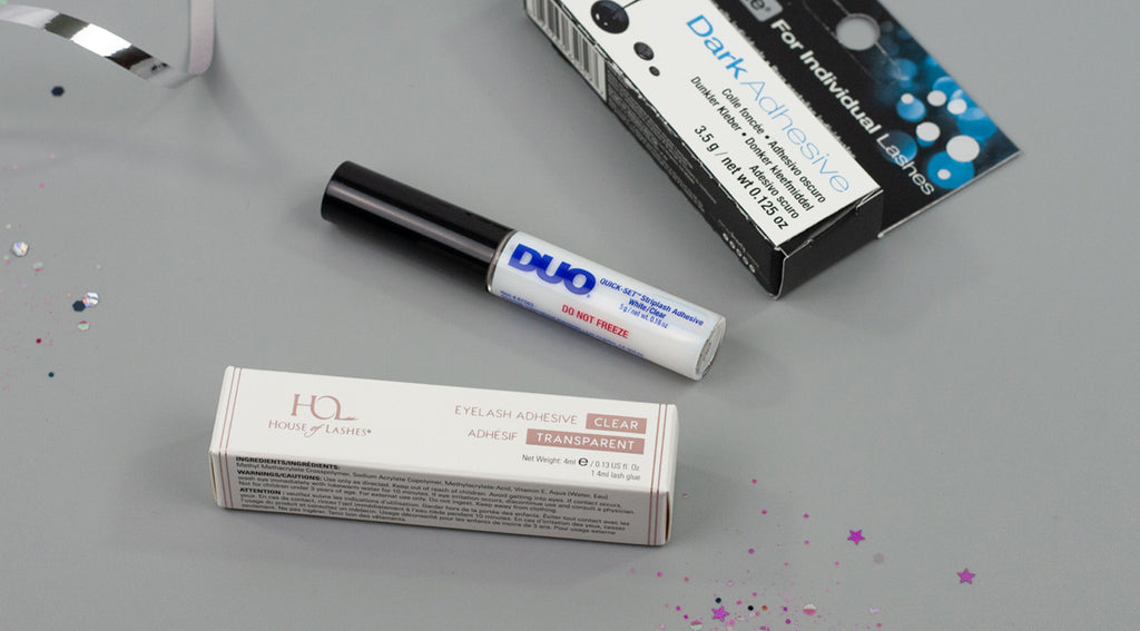 Flatlay of strip and individual lash glue