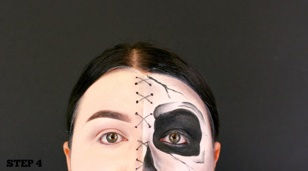 step 4 draw crosses down middle of face and dot to dot them like stitches 