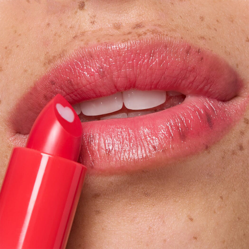 Essence Heart Core Fruity Lip Balm (3g) - Model Shot 1 [02 Sweet Strawberry]