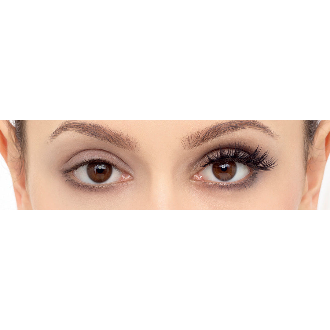 Close-up of a person’s eyes showing a comparison between natural and enhanced lashes. The right eye has natural lashes, while the left showcases the dramatic and dark Eylure Most Wanted Lashes - I Heart This, emphasizing a cruelty-free difference in length and volume.