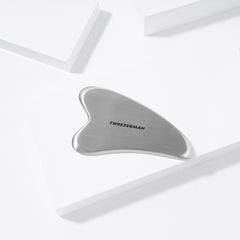 Tweezerman Stainless Steel Gua Sha (Lifestyle Shot)