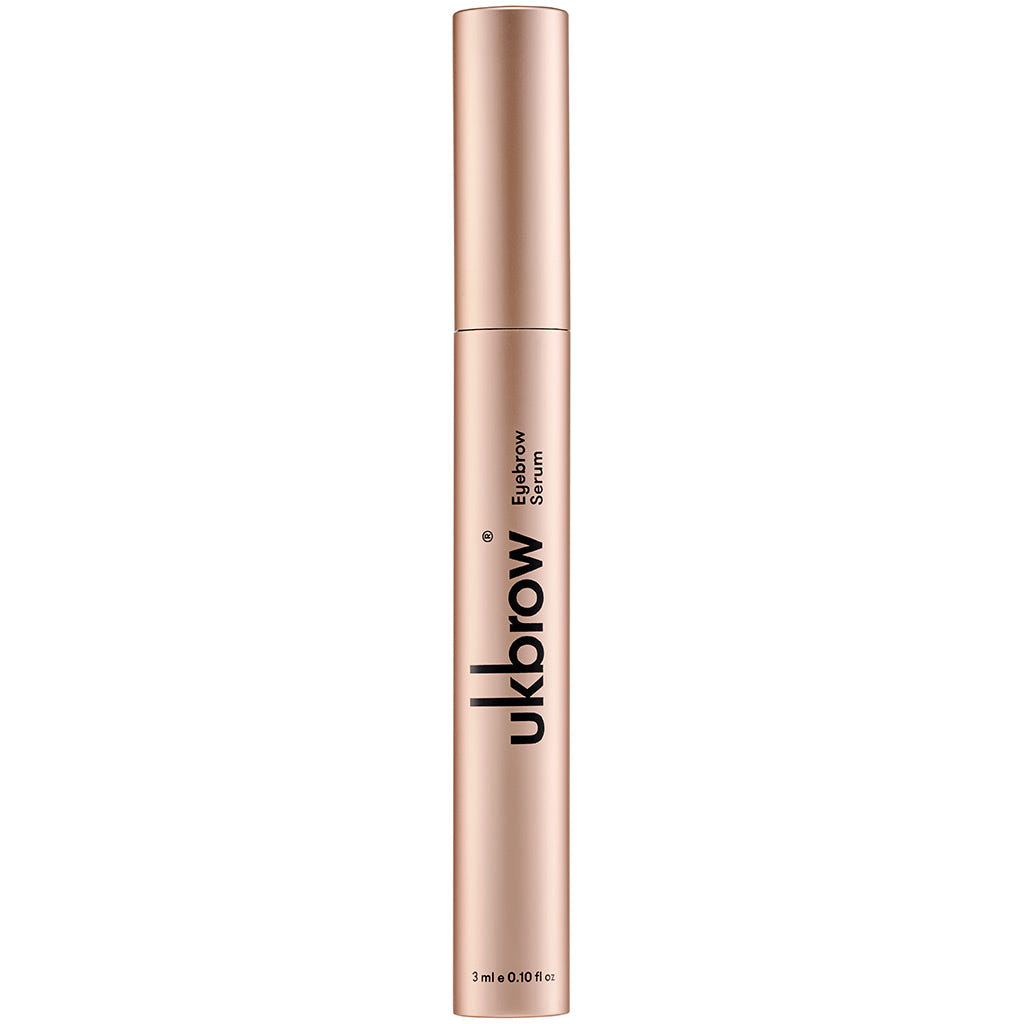 A sleek, metallic tube of UKLASH's "UKBROW" Eyebrow Serum stands upright against a white background. Black text adorns the tube, and the bottom indicates it contains 3ml (0.10 fl oz), promising to naturally enhance eyebrow hair growth.