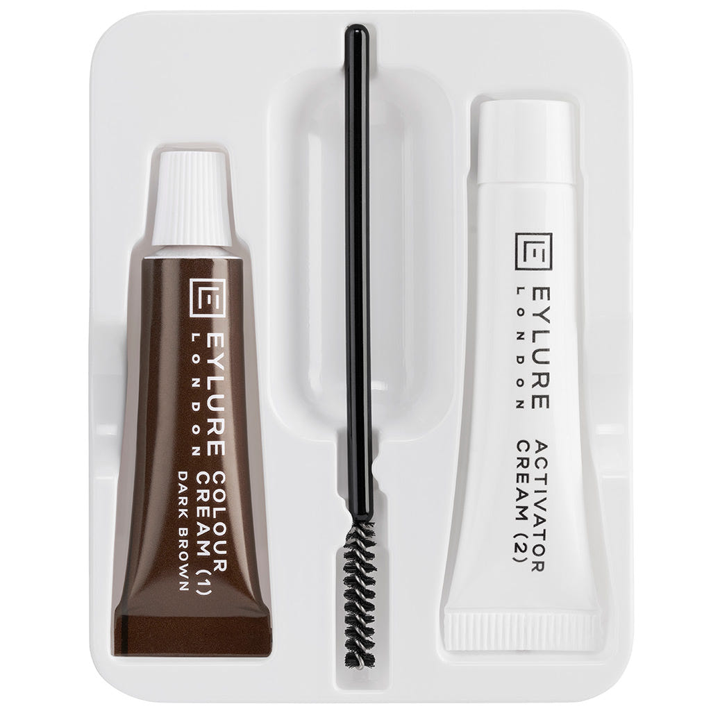 The Eylure Dybrow - Dark Brown kit includes a vegan-friendly dark brown color cream, a tube of cruelty-free activator cream, and a small brush applicator, all organized in a white tray.