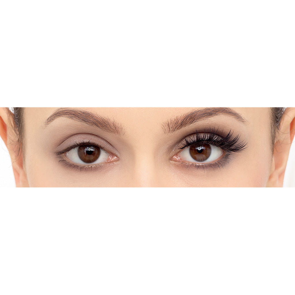 A close-up of a person's eyes shows a striking contrast: the left eye features natural lashes, while the right is enhanced with Eylure's Luxe Silk Lashes in the Ascher style, creating a winged-out finish that highlights the difference between natural and styled appearances.