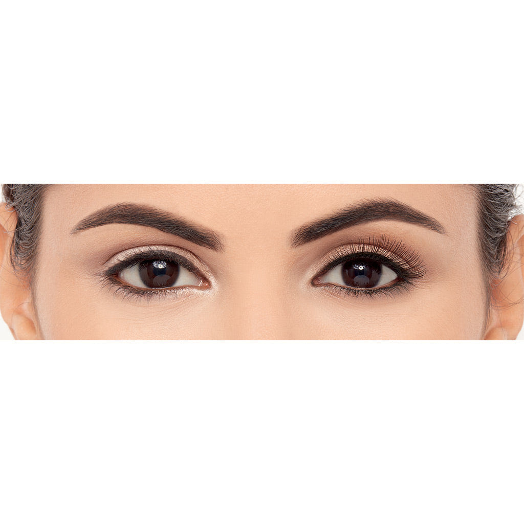 Close-up of a pair of eyes, one with natural makeup and the other featuring a dramatic flair using Eylure Pre-Glued Volume Lashes 100, showcasing long, thick eyelashes. The image highlights the contrast between subtle and bold eye makeup styles offered by Eylure.