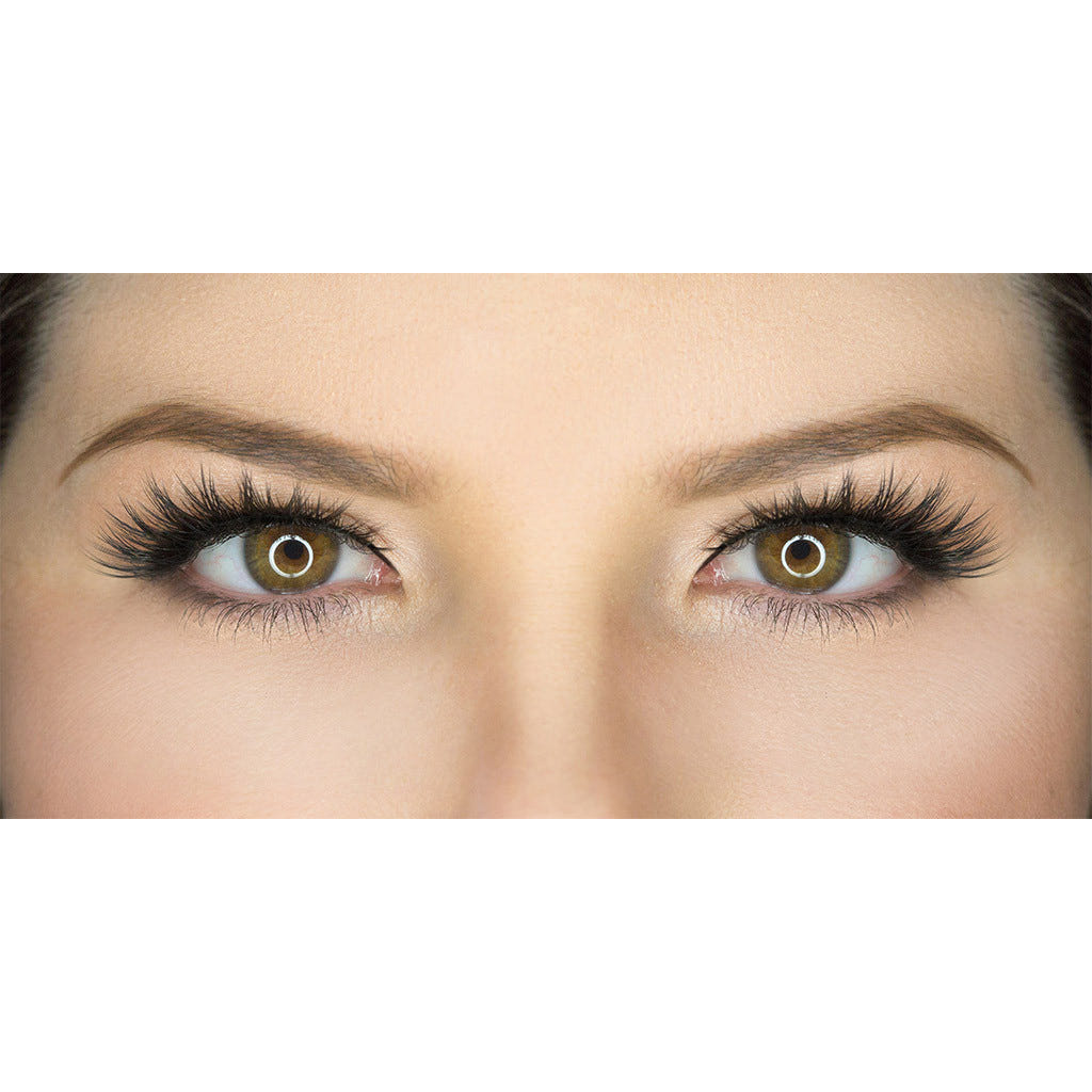 Close-up image of a person's eyes with long, dark, Iconic eyelashes by House of Lashes and well-groomed eyebrows. The eyes are looking directly at the camera, and the skin around the eyes is smooth and blemish-free. The iris color is hazel with a glowing ring effect.